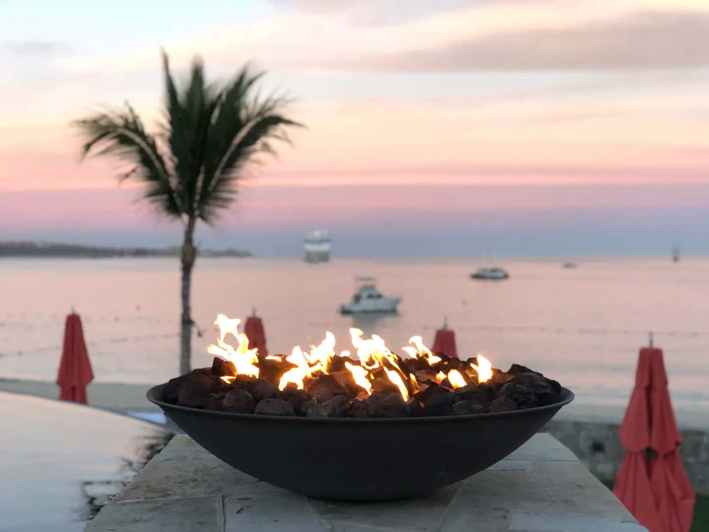 Fire bowl at sunset overlooking Cabo San Lucas bay