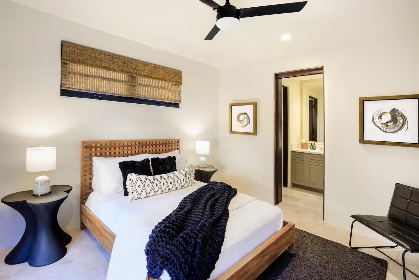 Guest bedroom 3 queen bed with ceiling fan and artwork