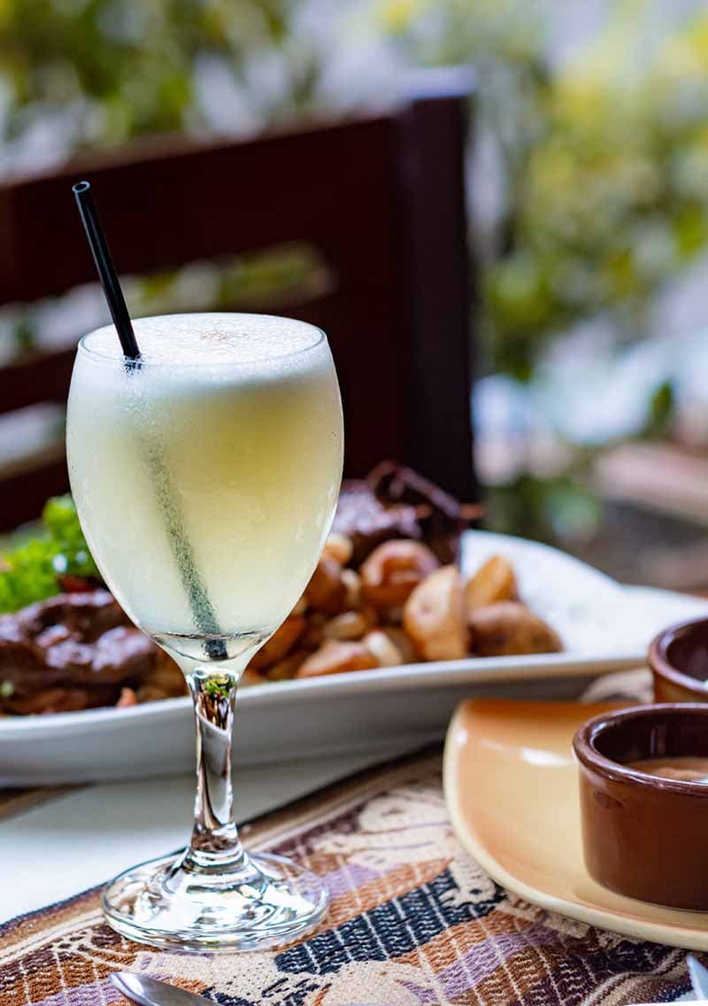 Cocktail and plated dish at a Cabo San Lucas restaurant
