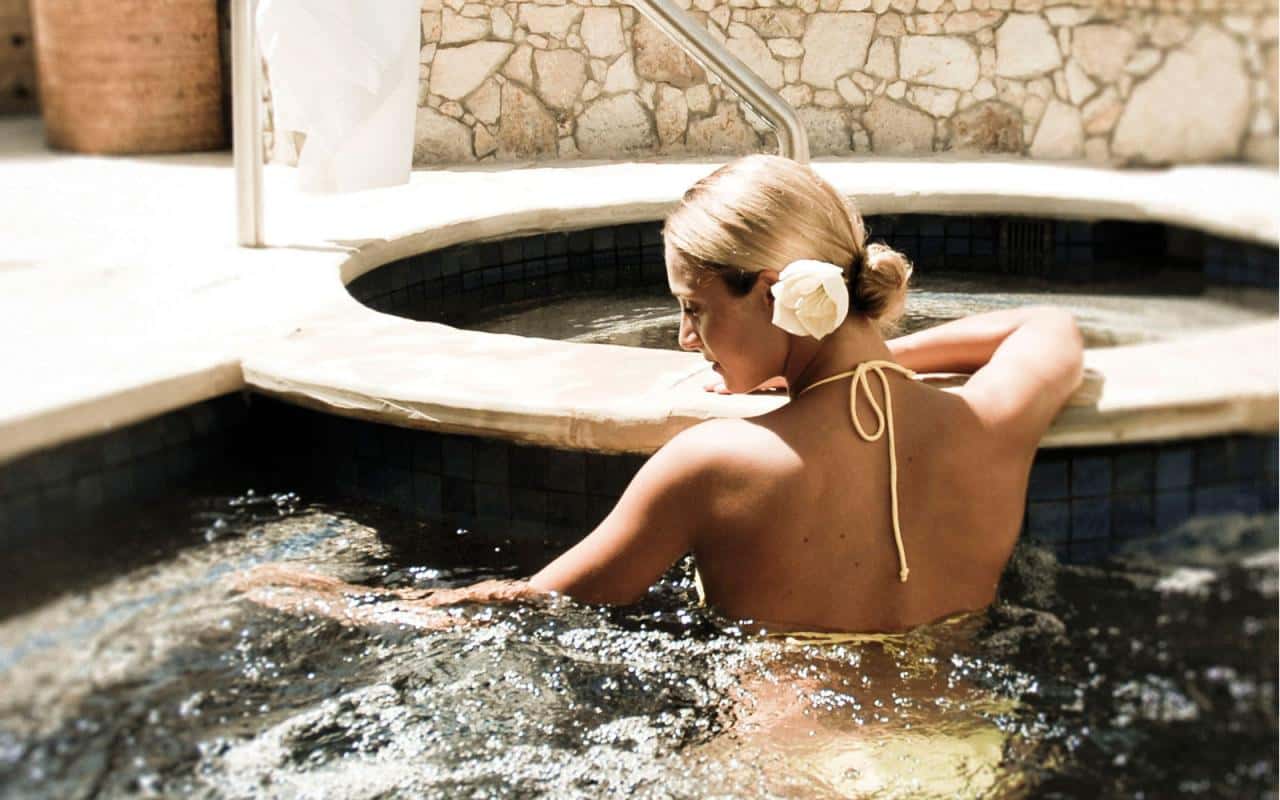 Guest relaxing in the hot tub at the Hacienda Beach Club spa