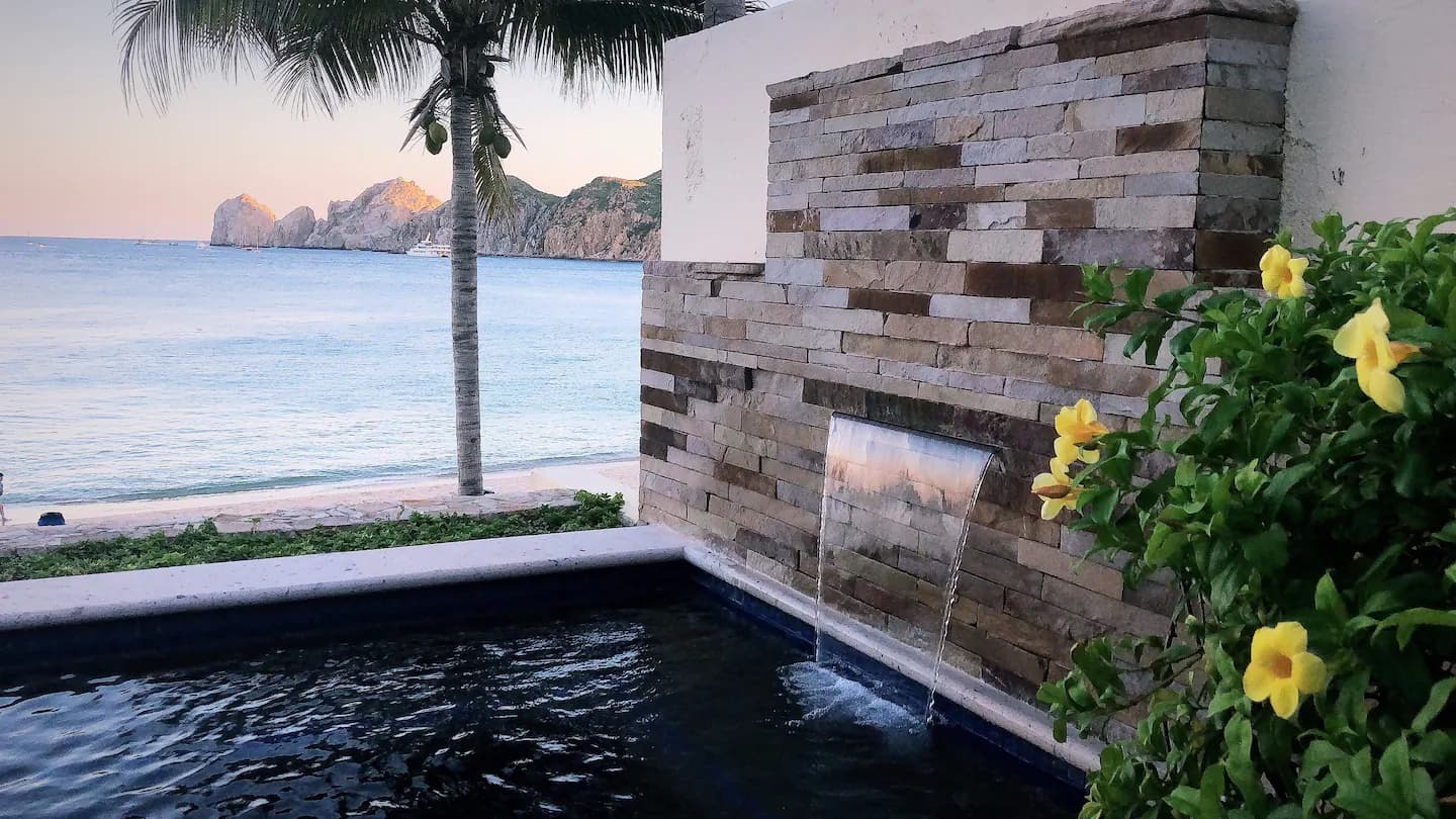 Hot tub waterfall with a view of Land's End