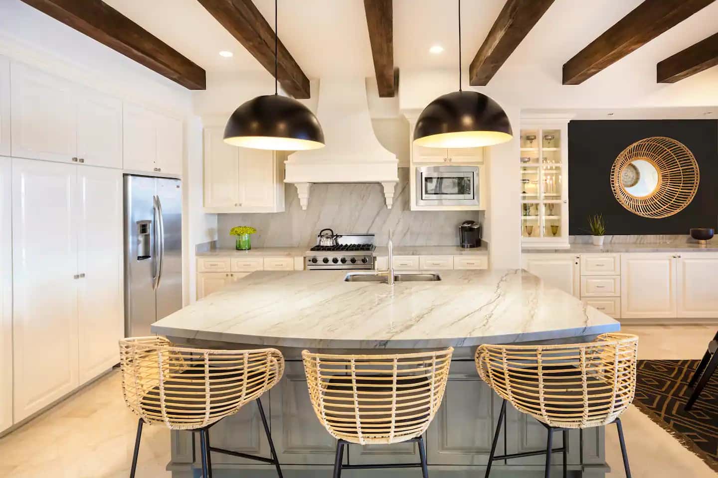 Fully appointed kitchen with island seating at Villa 1