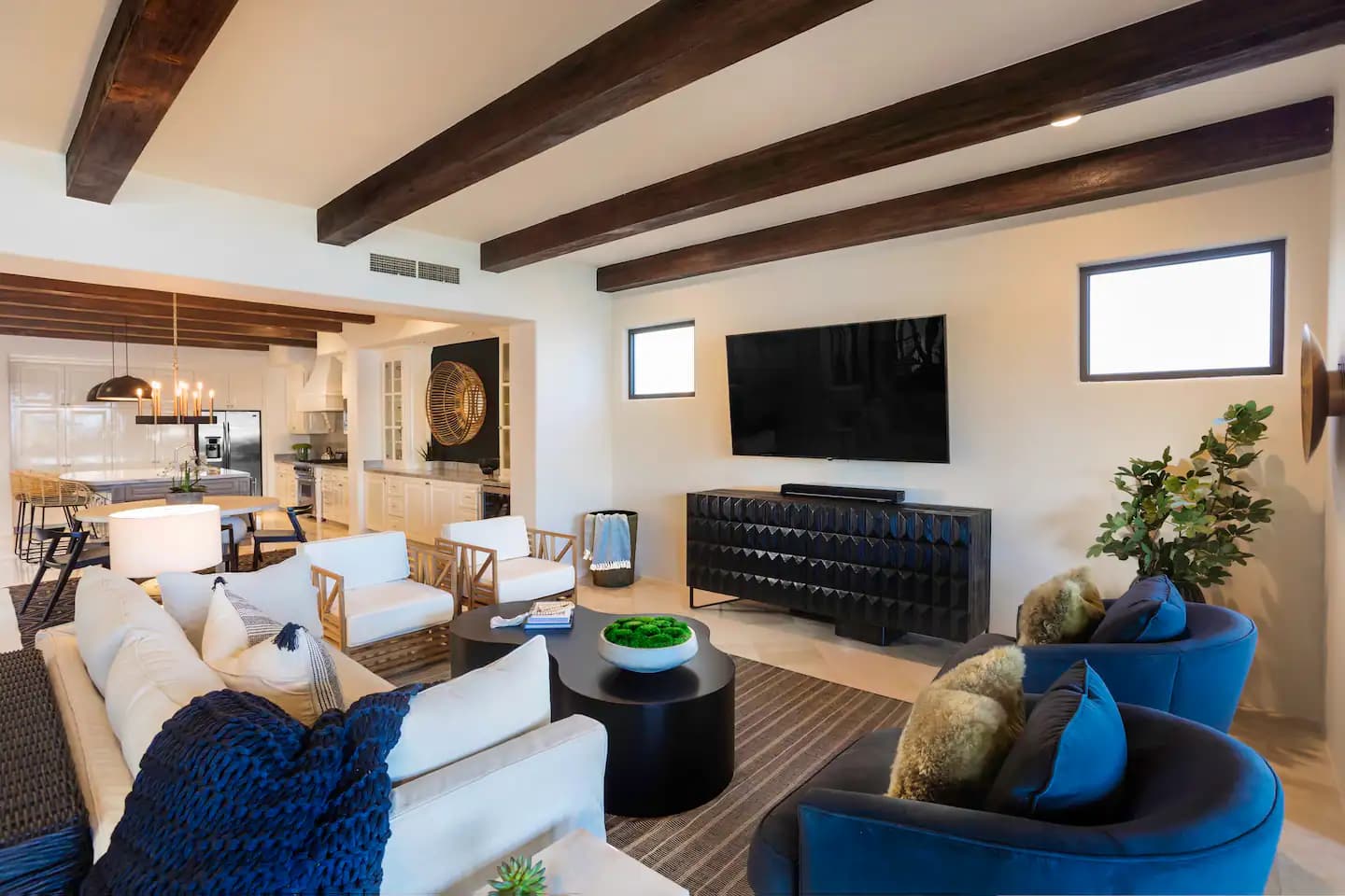 Living room with large TV and lounge seating