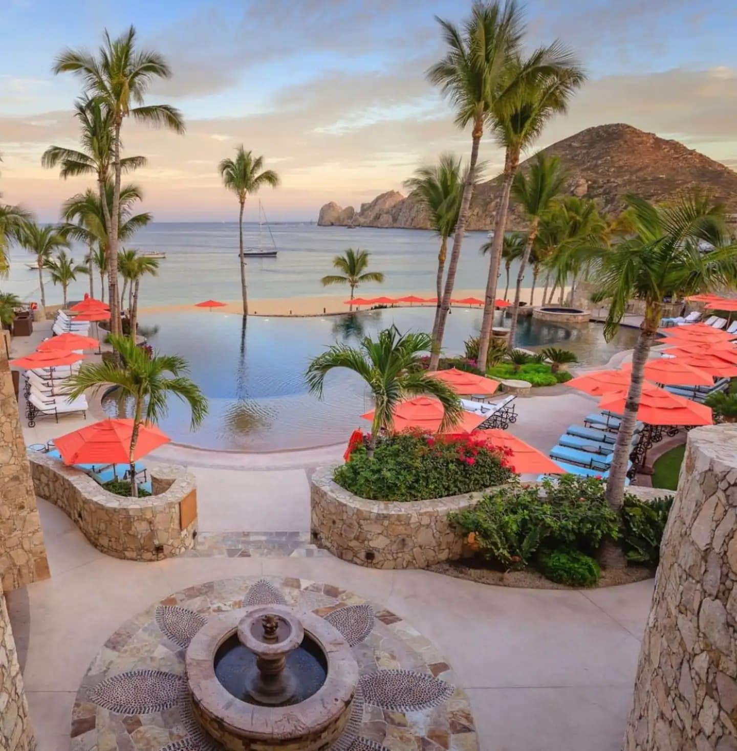 Hacienda Beach Club pool with red umbrellas
