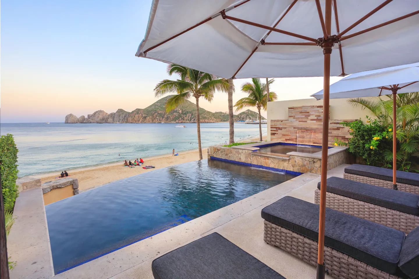 Pool terrace with umbrella and views of Land's End