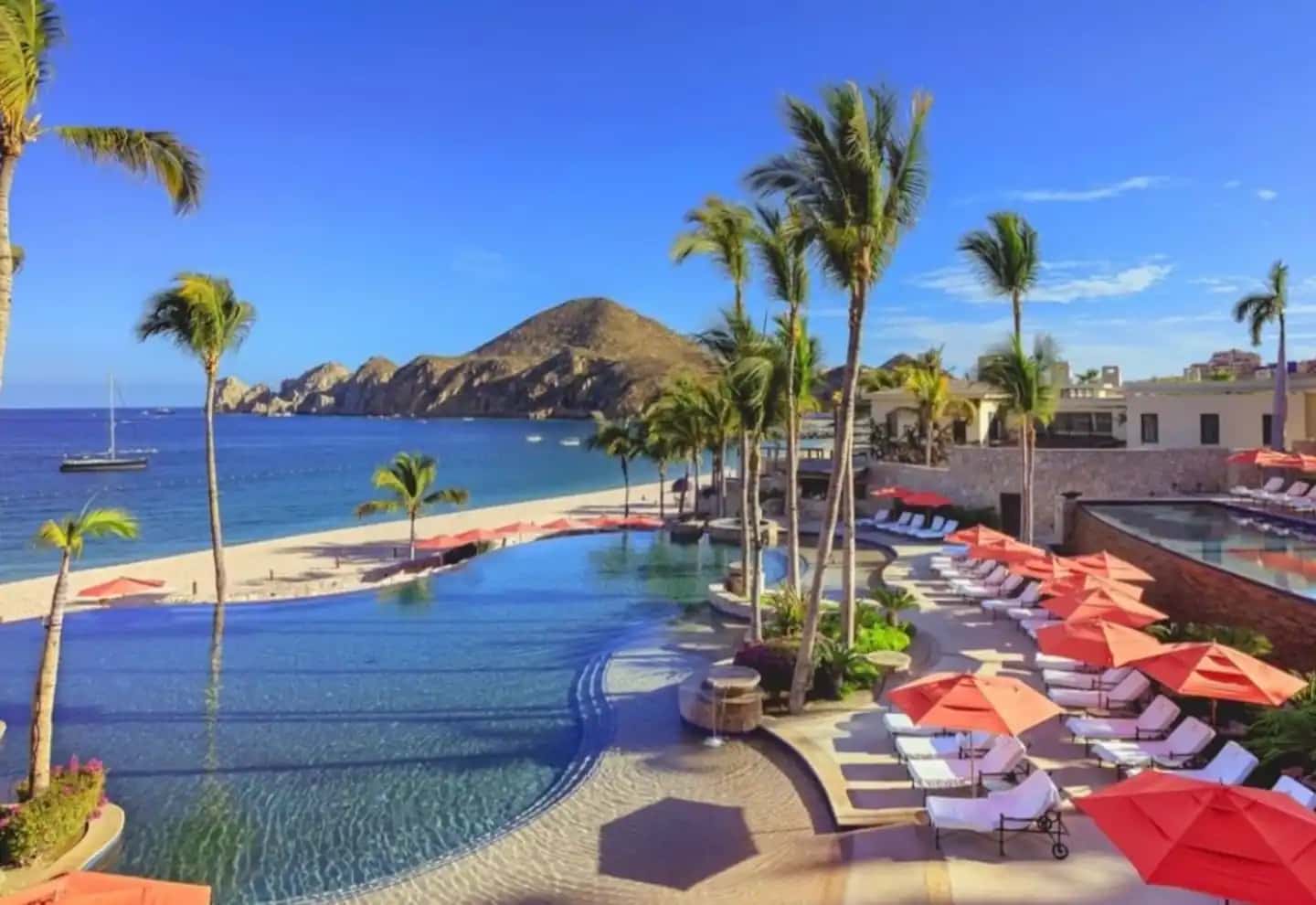 Aerial view of Hacienda Beach Club pools and Médano Beach